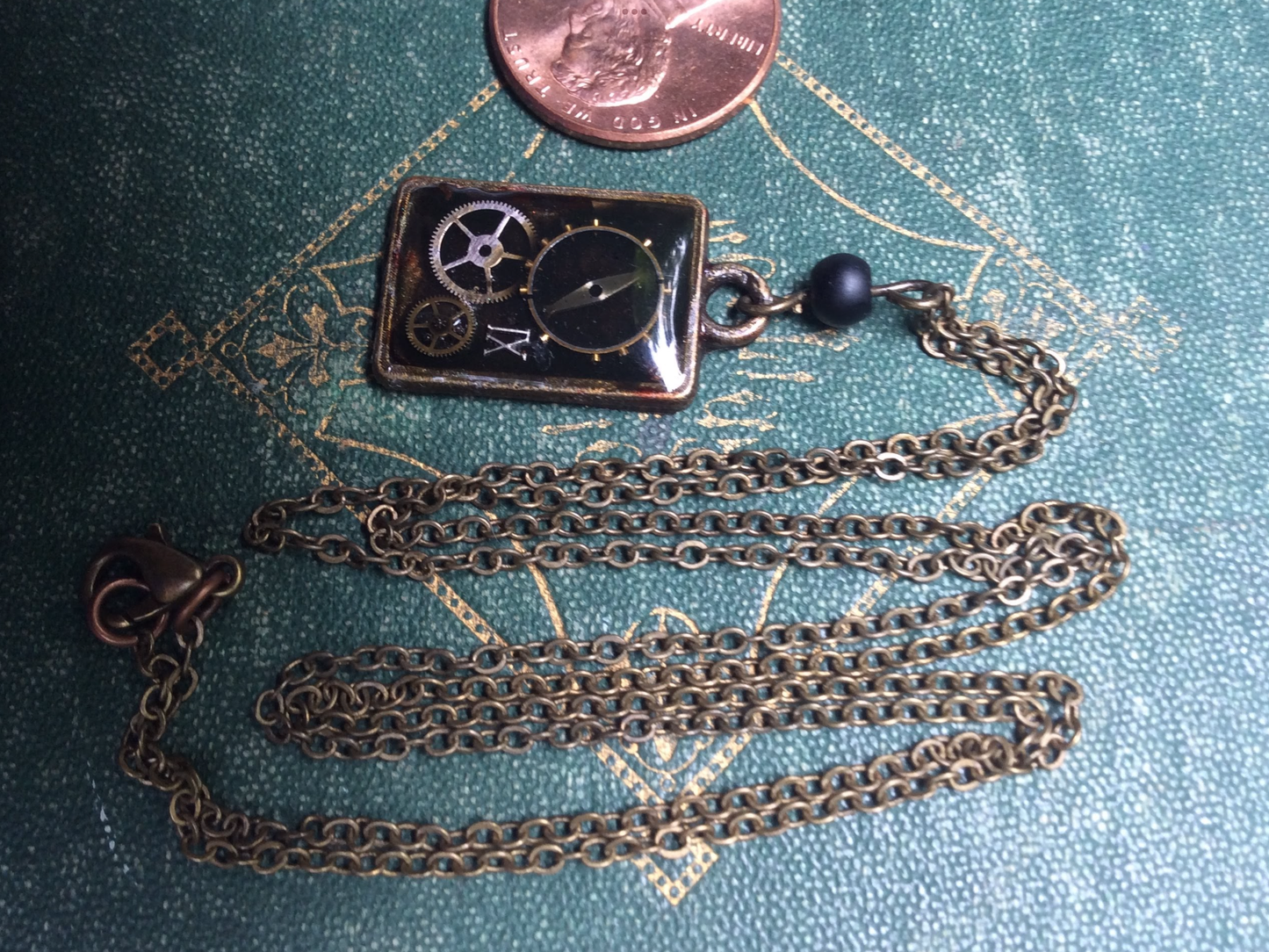 StEaMpUnK resin necklace with tiny clock gears from a REAL - AnTiQuE - pocket watch