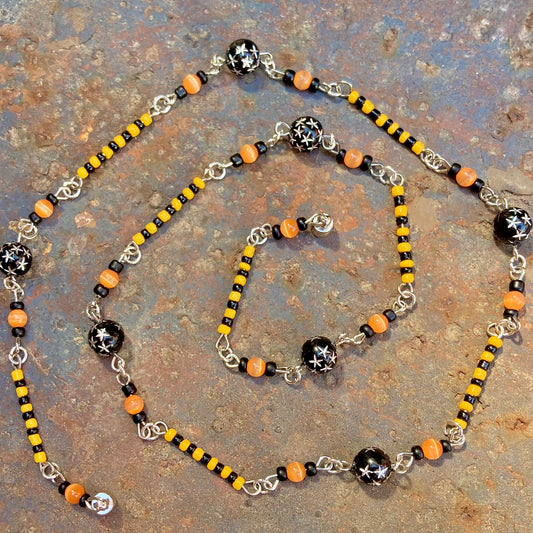 Halloween witchy star necklace with black and orange beads