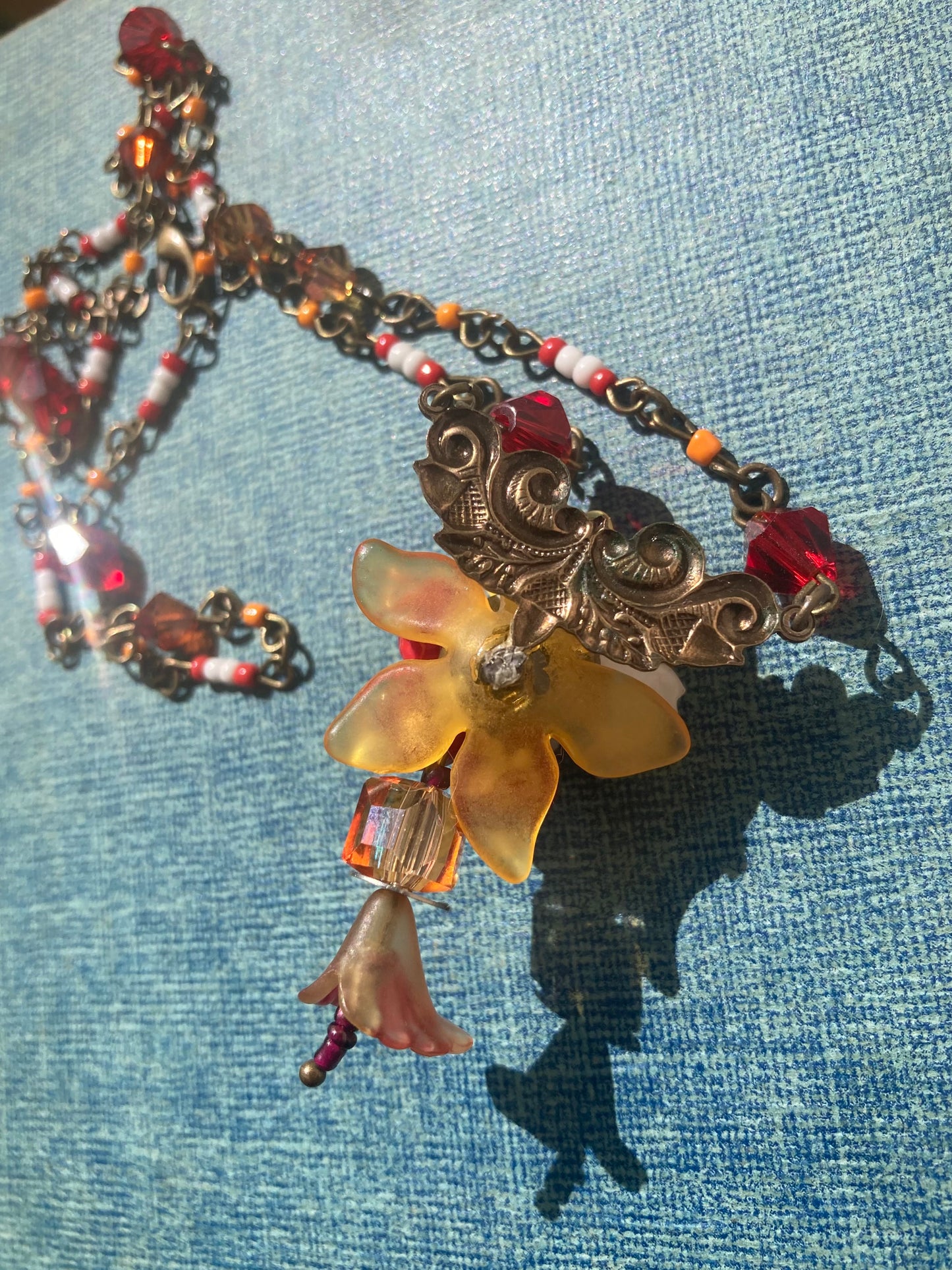 Red Floral beaded necklace - Swarovski crystals - upcycled vintage charms
