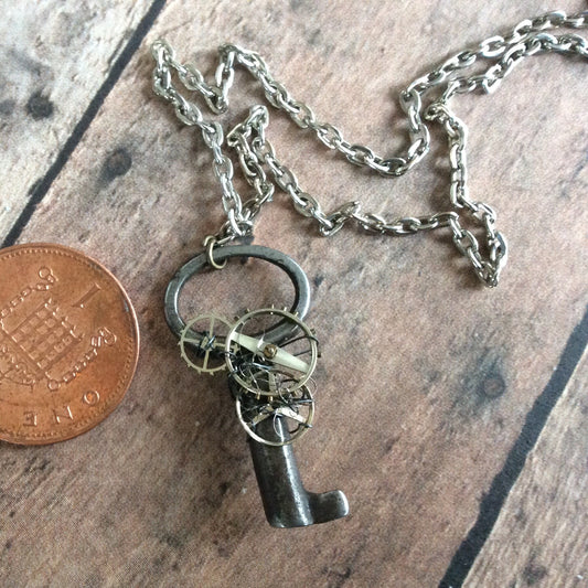Tiny StEaMpUnK necklace with a REAL - AnTiQuE - key and watch parts and gears