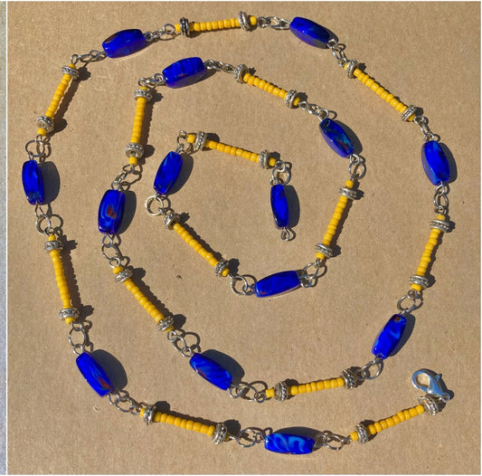 Long beaded necklace in rich blue and golden yellow