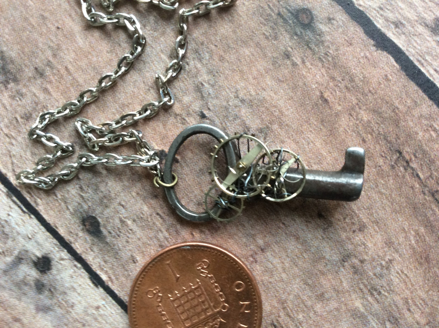 Tiny StEaMpUnK necklace with a REAL - AnTiQuE - key and watch parts and gears